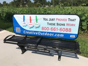 outdoor advertising on bus bench in modesto